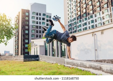 Skateboarder Handstand On Ramp On The Sunset.