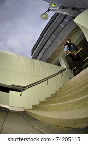 skateboarder jumping down a massive set of stairs.