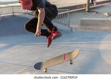 Skateboarder Jumping In A Skatepark