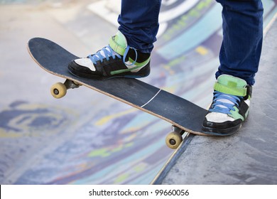 Skateboarder legs before jumping on the railing - Powered by Shutterstock