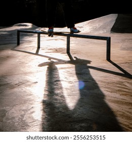 A skateboarder mid-air performing a trick at Kingsbridge Skatepark on a sunny day, surrounded by trees, parked cars, and urban scenery - Powered by Shutterstock