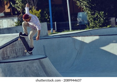 Skateboarder Portrait Jumping At Skate Park. Sunset Light, Life Style.