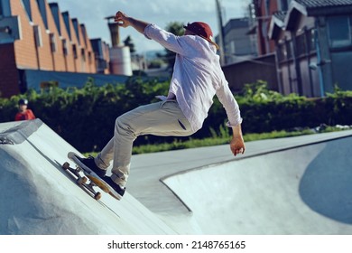 Skateboarder Portrait Jumping At Skate Park. Sunset Light, Life Style.