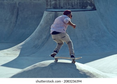 Skateboarder Portrait Sliding At Skate Park. Sunset Light, Life Style.