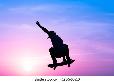 skateboarder silhouette jumping in skatepark