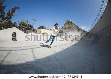 Similar – Junge Person mit Skateboard im Skatepark