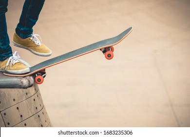 Skateboarder Skateboarding At Skatepark Ramp