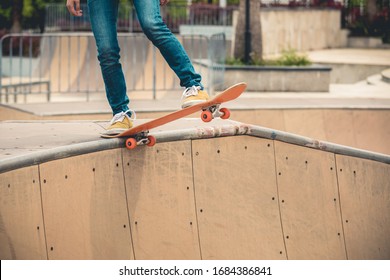 Skateboarder Skateboarding At Skatepark Ramp