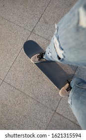 Skateboarder Skateboarding At Sunset City