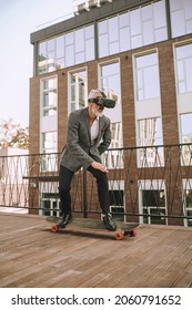 Skateboarding Male Gamer Playing A 3D Game Outside