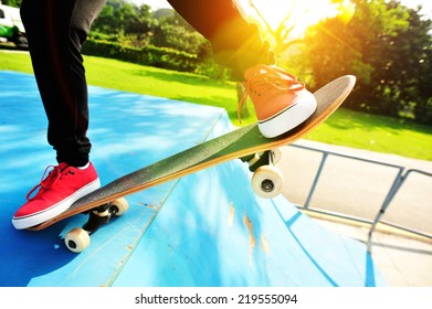 skateboarding woman legs at sunrise skatepark  - Powered by Shutterstock