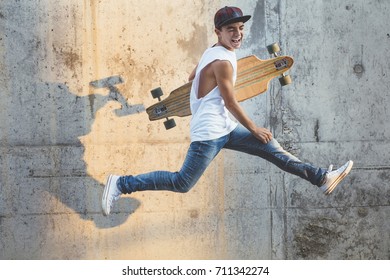 Skater Boy Jumping With Longboard.