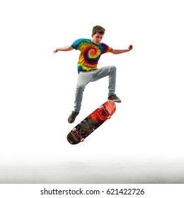 Skater Doing Kickflip - Isolated On White Background