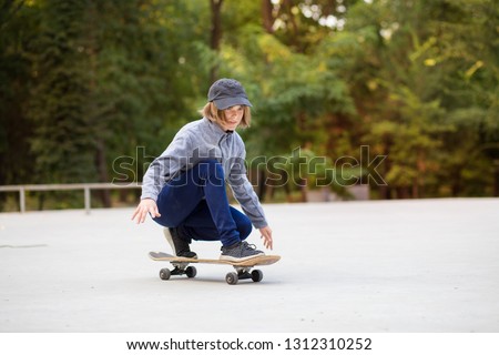 Similar – teenager practicing with skateboard at sunrise city