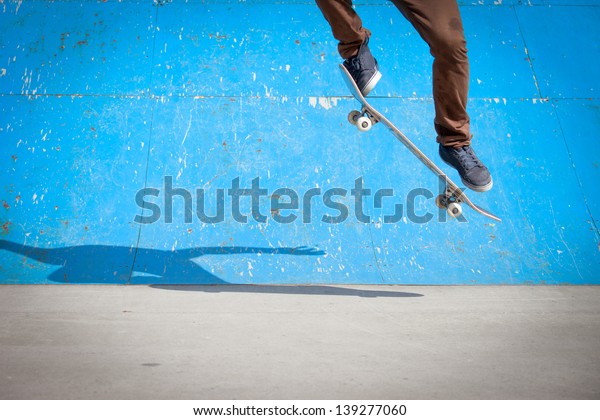 Skater jumps high in\
air under extrem-park