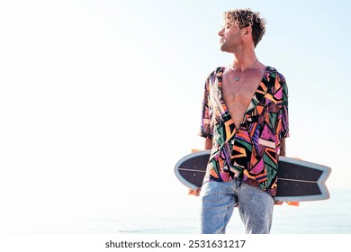 skater in trendy summer outfit carrying skateboard - Powered by Shutterstock