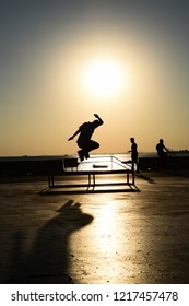 Skaters in reverse light