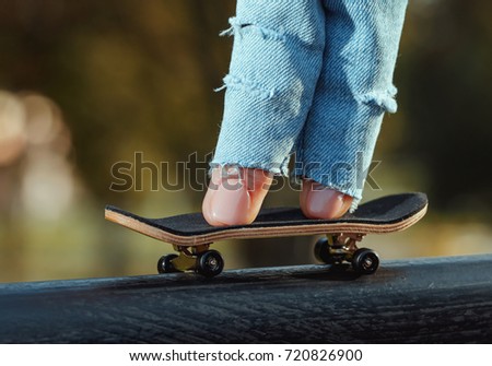 Skating on the fingerboard, training process. Closeup