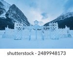 Skating rink and carved ice castle on Lake Louise in winter at Alberta, Canada