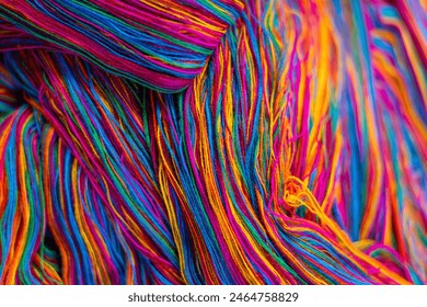 Skeins of colorful, vibrant, mixed rainbow colours of cotton thread, ready to be woven into traditional Guatemalan textiles. Abstract, fashion and travel, background texture. 