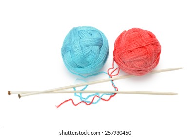 Skeins Of Yarn And Knitting Needles Isolated On A White Background