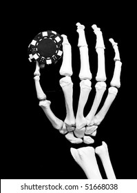 skeletal hand with poker chips