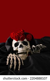 Skeleton In Black Cloak On Blood Color Background With Roses On Head, Halloween Concept