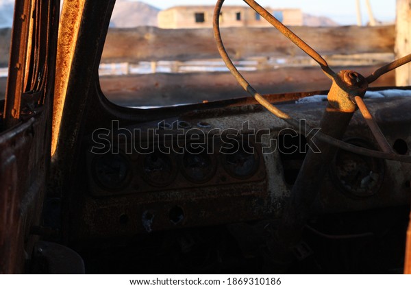 Skeleton\
of Burnt Car Steering Wheel Old Van Rusty\
Metal