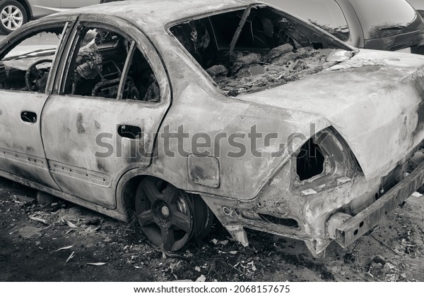 Skeleton of\
burnt out car.Trunk of a burnt out\
car