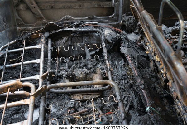 the skeleton of\
car seats of a burnt-out\
car