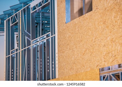 Skeleton Frame Residential Construction. Closeup Photo. Metal Frame And The Plywood Walls. 