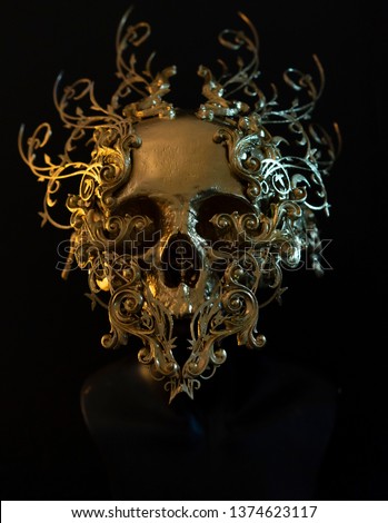 Skeleton, golden skull made with 3d printer and pieces by hand. Gothic piece of decoration for halloween or horror scenes
