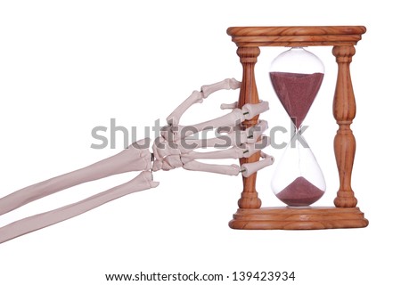 skeleton hand holding sand timer