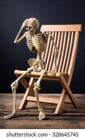 skeleton in headache posture