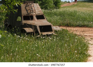 The Skeleton Of An Old Ruined Armored Car In A War Zone
