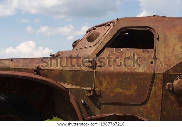 The\
skeleton of an old ruined armored car in a war\
zone\
