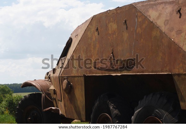 The
skeleton of an old ruined armored car in a war
zone
