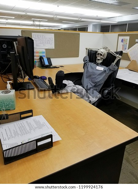 Skeleton Relaxes His Feet On Desk Stock Photo Edit Now 1199924176