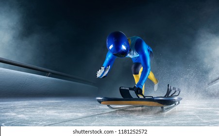 Skeleton Sport. The Athlete Descends On A Sleigh On An Ice Track. Winter Sports