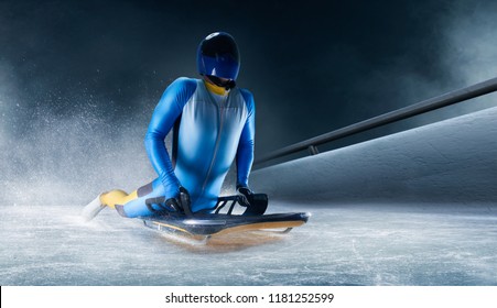 Skeleton Sport. The Athlete Descends On A Sleigh On An Ice Track. Winter Sports