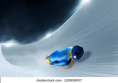 Skeleton Sport. Athlete Descends On A Sleigh On An Ice Track.