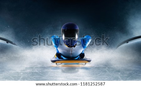 Skeleton sport. The athlete descends on a sleigh on an ice track. Winter sports