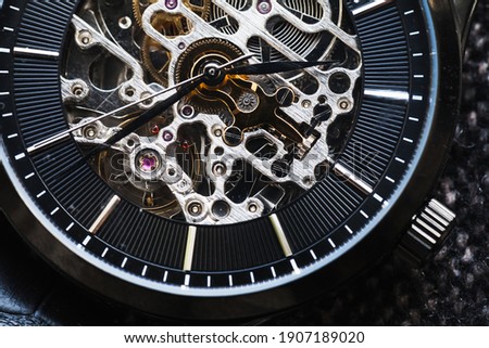 Skeleton watch close-up photo, it is a mechanical watch type in which all of the moving parts are visible