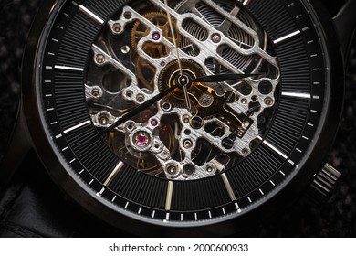 Skeleton wrist watch close-up photo, it is a mechanical watch type in which all of the moving parts are visible