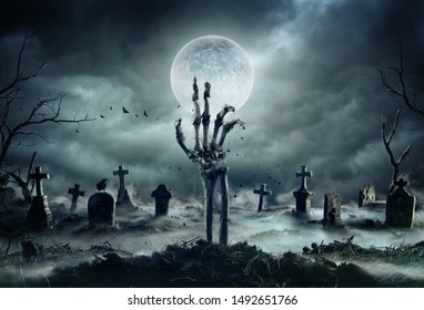 Skeleton Zombie Hand Rising Out Of A GraveYard - Halloween - Shutterstock ID 1492651766