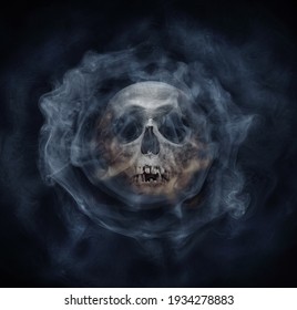 A Skeleton's Skull And Smoke. Horror Stories,  Phantom,  Apparition, Wraith, Spook Phantasm Background. Old Gothic Style.