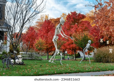 Skeletons and skulls are traditional attributes of Halloween in America. Frontyard decoration for Happy Halloween. - Shutterstock ID 2346811663