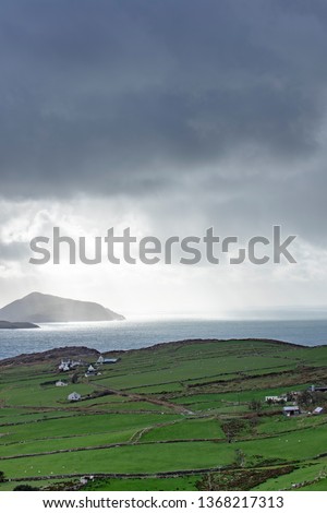 skellig michael off the coast of the ring of kerry in winter showing deep blue waters and crashing waves