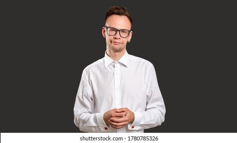 Skeptic Man Portrait. Stupid Joke. Judging Guy With Sarcastic Smile Isolated On Black. Confident Nerd Disapproving Bad Idea. Loser Shame. Wrong Choice.