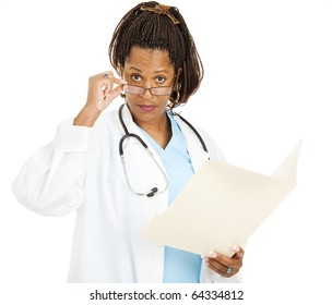 Skeptical Female Doctor, Holding A Chart, Looks Over Her Glasses At You.  Isolated On White